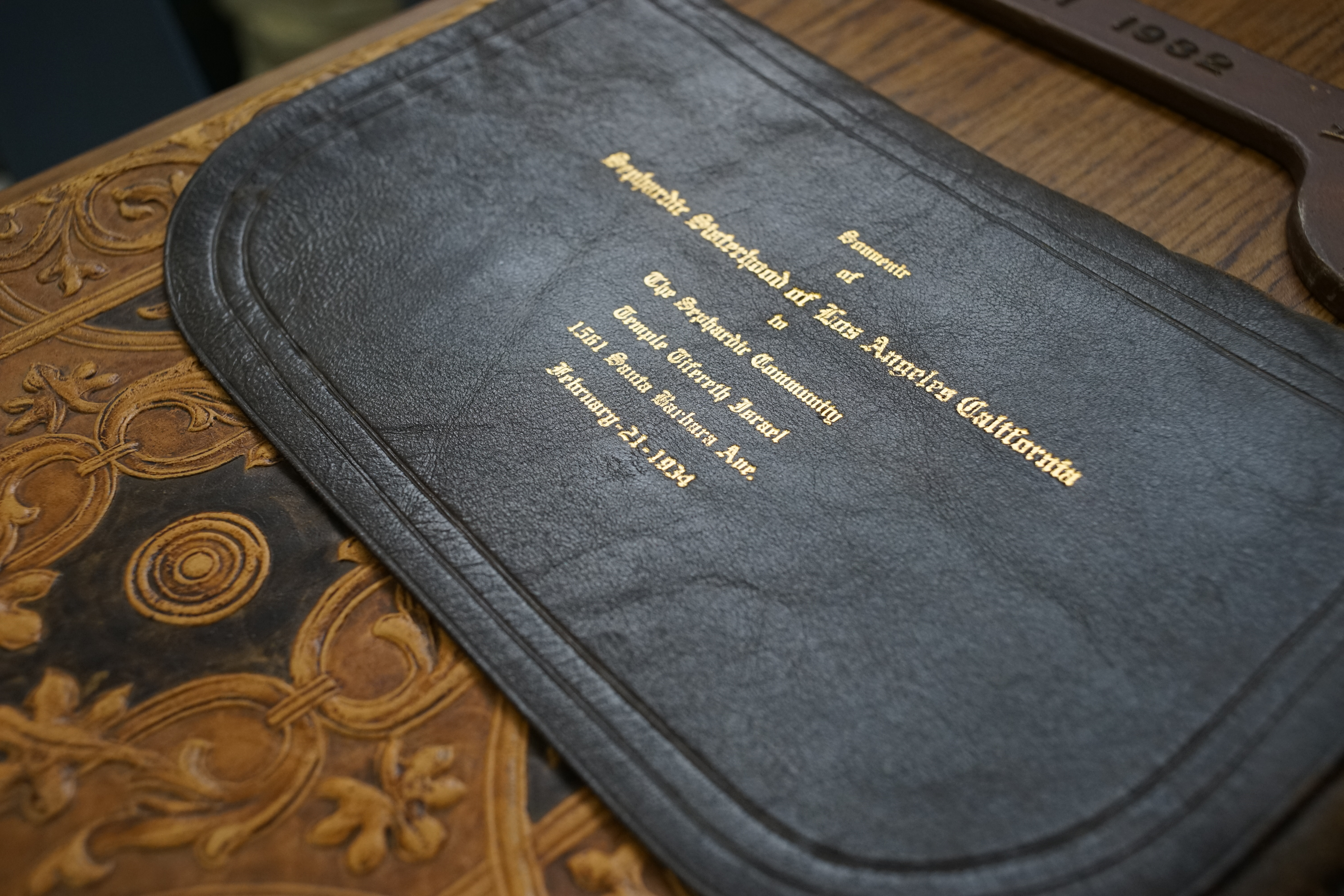 Image of sample item in Sephardic Temple Tifereth Israel collection. Intricately decorated document holder dated February 21, 1934.