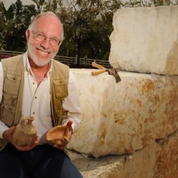 Robert Mullins, a associate professor of biblical studies hold a couple of ancient artifacts at Azusa Pacific University in Azusa, Calif., on Friday, May 4, 2012. Professor Mullins has been granted permission to excavate the last unexplored biblical-era site in Israel.
 (SGVN/Staff Photo by Keith Birmingham)