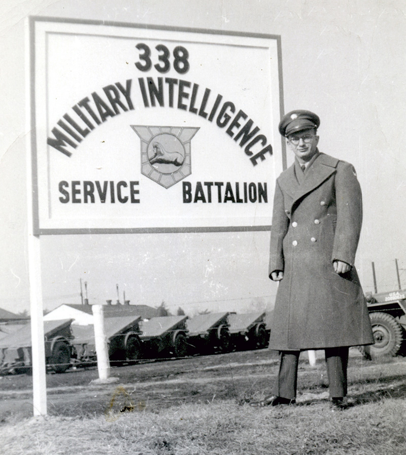 Al in front of Military Intelligence sign