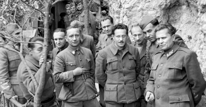 Marshal Tito stands with his Cabinet Ministers and Supreme Staff at his mountain headquarters in Yugoslavia on 14 May 1944.